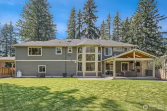 Spacious backyard with flat, fully fenced lawn—perfect for playsets, a playhouse, or even a small soccer pitch. Ideal for outdoor fun, entertaining, and flexible family living in a secure and private setting.