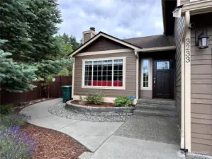 Inviting entryway with access to the large fully fenced back yard.