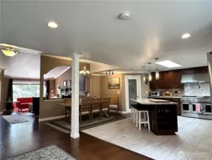 This is such an inviting home and space. The thoughtfully designed 75K remodel added the chef's kitchen with heated floors, tons of counter space and storage, designer lighting, huge island with sink and power, 56" GE Monogram commercial 6 burner stove with built in griddle, double oven & matching exhaust hood. Large pantry, beautiful cabinetry w/ under mount lighting and more.