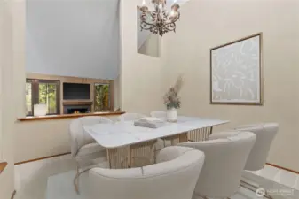 Formal dining room area virtually staged visible to the living room