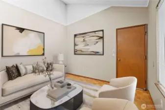 Extra family room off of kitchen island side & entrance to garage- virtually staged