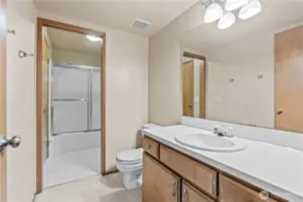 En Suite primary bathroom opens up to another door that connects to hall bathroom for easy access to full shower & tub