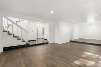 Great room and stairs leading upstairs