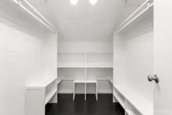 Primary bedroom walk in closet