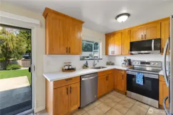 New cabinets, quartz counters,  Microwave, dishwasher, range & backsplash adorn this heart of the home! Grow your favorite herbs in the kitchen Garden window.