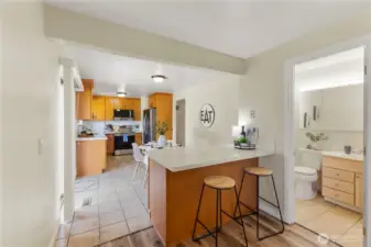 The bar seating area offers extra kitchen storage and a great place to do homework while dinner's being prepared.