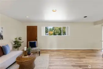 The Family Room offers a door to the back yard, and a 1/2 bath,