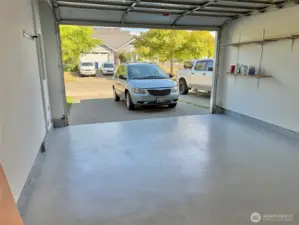 Oversized one car garage and driveway.  At 16' wide it would easily fit TWO 1974 Honda Civics!