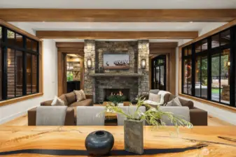 6” thick solid bluestone mantle weighs over 2000 lbs. The fireplace goes through the  floor and sits on a concrete footing so that the over 18,000lbs total weight is not sitting  on the floor system.