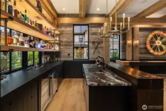 30,000.00 dollars worth of custom lighting in this room alone!!! The lighted bar shelves  are amazing, and the torch lights on the posts make for amazing mood lighting at night.