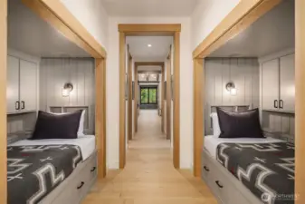 Independent  reading lights and charging stations in each bunks recessed bookshelf at headboard.