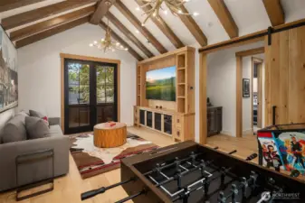Game room has outdoor balcony, 2EA large sliding barn doors for privacy and sound  control.