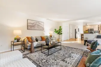 Expansive great room with multiple windows and open sightlines, ideal for entertaining and relaxation.