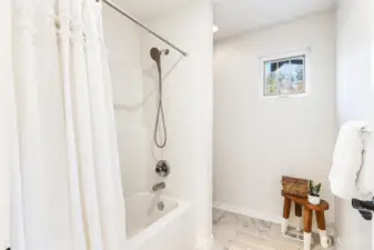Clean, well-appointed ¾ bathroom provides convenient access for the additional rooms.