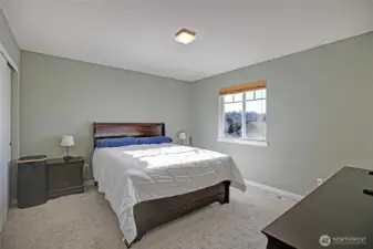 This peaceful primary bedroom offers a comfortable retreat with soft natural light and a relaxing atmosphere. An attached ¾ bath adds everyday convenience and a touch of privacy.