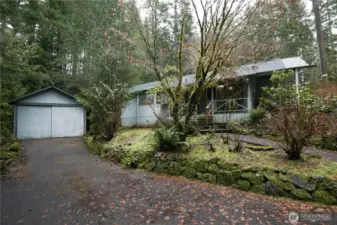 Front of home with 2 car detached garage