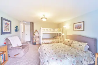 Large downstairs family room—great for movie nights or extra sleeping space.