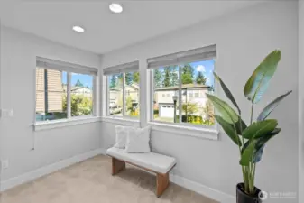 Upstairs, you will find a arge landing at the top of the stairs. Enjoy the sunrise view from the windows -this would be a great place for a reading nook.