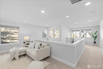 The loft area is a perfect spot for a playroom, media room or office.