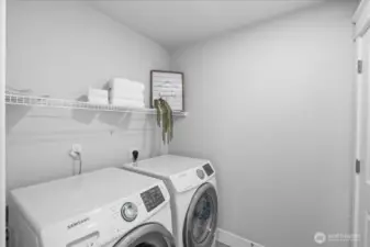 The upstairs laundry room makes staying organized on laundry day a cinche.