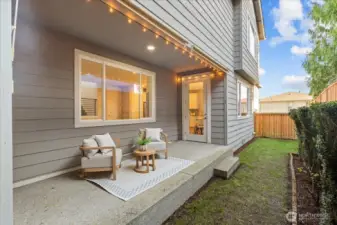 Step out onto the covered patio and enjoy the low maintenance backyard year round