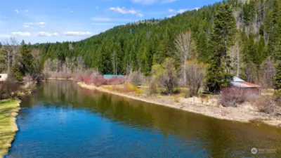 This lovely cabins sits on low bank Yakima River.