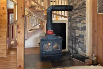 A wood stove is placed perfectly in the center to spread the warmth.