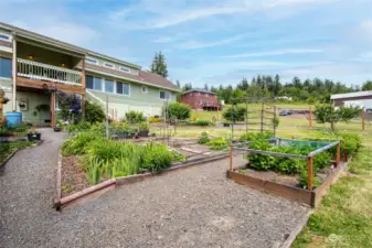 under the deck is a full on storage unit under the house. The gardens are amazing!