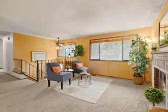 Living Room with natural light, big windows and gas fireplace.