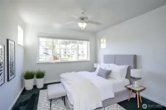 Spacious and sun-filled upper-level guest suite, designed for comfort and relaxation - virtually staged for inspiration.