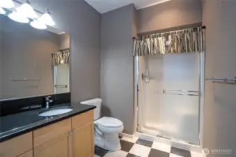 Well-placed lower-level guest bath, perfect for accommodating guests enjoying entertainment and activities.