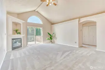 Back Living room with propane fireplace and lofted ceilings