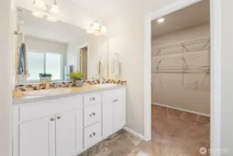 The primary bathroom's double vanity and full size mirror makes getting ready a breeze.