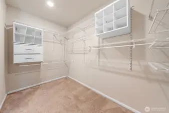 Extra large primary closet with built in storage is a dream.