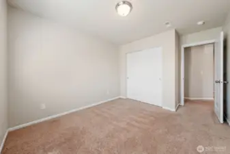 Guest Bedroom #2 with double door closet.