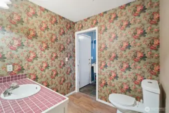 Main Floor powder room, door leads into the laundry room.