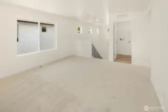At the top of the stairs you will find a big loft area / bonus room. The laundry room is to the right hand side   of the stairs.