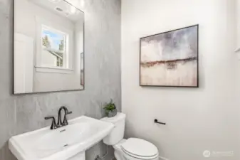 Powder room on main floor. Interior photos are of the Sheridan model home at Maywood Heights. Same floor plan but colors and finishes will vary. Photos are for illustration purposes only.