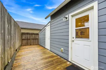 Deck and side entrance home and garage door