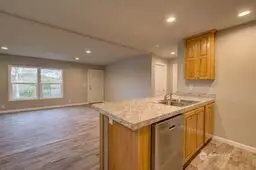 View of kitchen to front door.