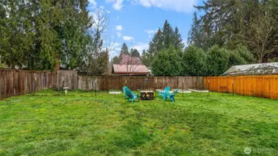 Huge back yard is cross-fenced to protect garden area from pets.