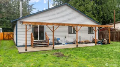 Clear patio cover provides protection from the elements while allowing light into the home.