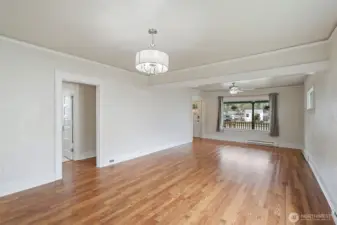View of living room looking out the large front window.