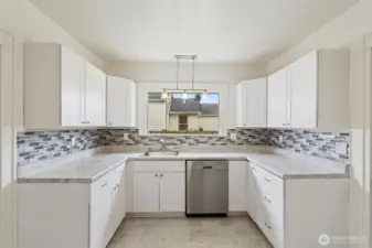 Kitchen window binging in more natural light.