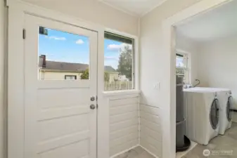 Door to the backyard and access to the garage.