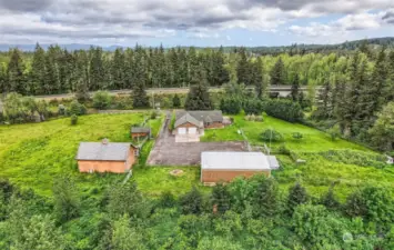 Cross fenced acreage with 2 separate pastures, 3 bay shop, garden area, raised garden beds, barn with 2 stalls and plenty of room for everyone