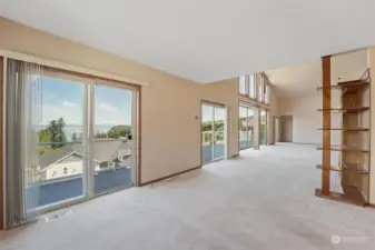 Main floor sitting room with views and deck access.