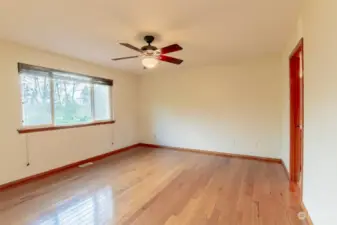 Large primary bedroom overlooking park-like back yard