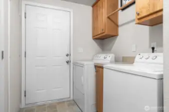 Laundry room with door to garage