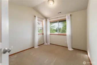 Bedroom 2 including vaulted ceilings